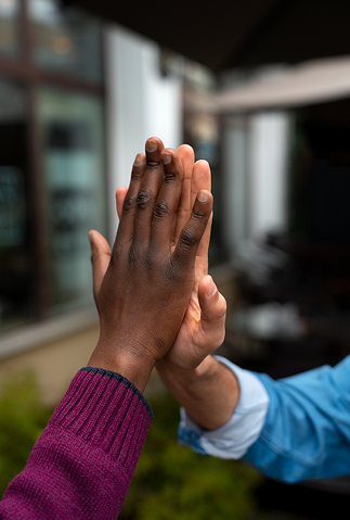Two people sharing a high-five
